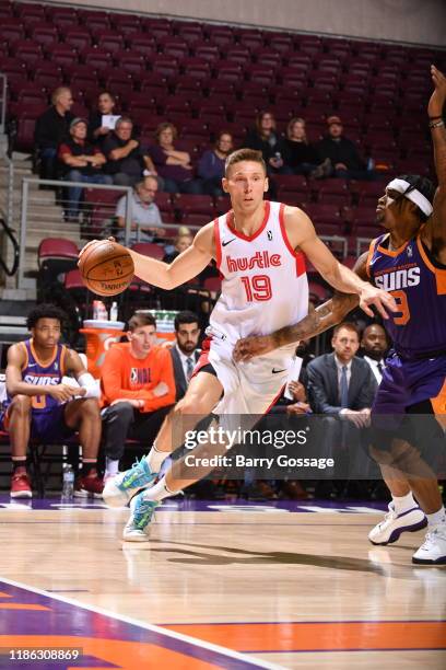 Jarrod Uthoff of the Memphis Hustle drives against Ahmed Hill of the Northern Arizona Suns on December 3 at the Findlay Toyota Center in Prescott...