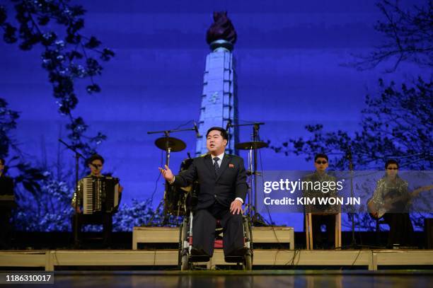 In a photo taken on December 3, 2019 paraplegic Ri Guk Chol performs during an event to mark the International Day of Persons with Disabilities, at...