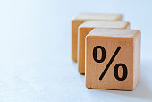 Set of wooden dices with percent symbol