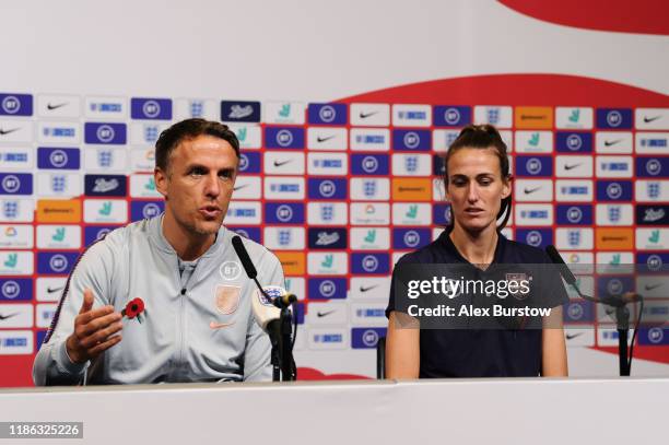 Phil Neville, Manager of England speaks to the media as Jill Scott of England looks on during a press conference on the eve of the Women's...