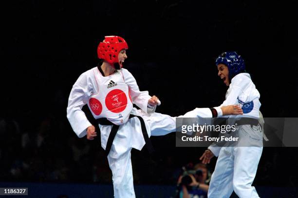 Lauren Burns of Australia and Urbia Melendez Rodriguez of Cuba in action during the Women's 49kg Taekwondo Final held at the State Sports Centre...