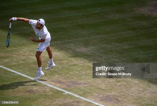 Joao Sousa of Portugal in action during the Men's Fourth Round against Rafael Nadal of Spain at The Wimbledon Lawn Tennis Championship at the All...