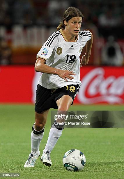 Kerstin Garefrekes of Germany runs with the ball during during the FIFA Women's World Cup 2011 Quarter Final match match between Germany and Japan at...