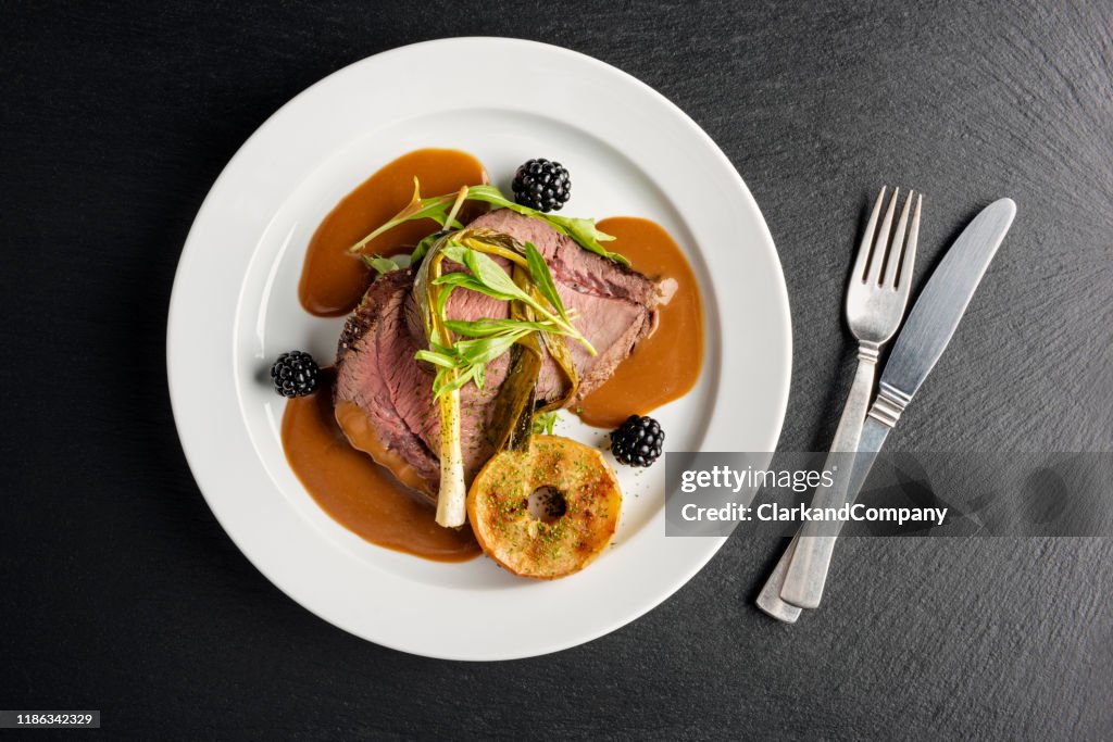 Venison with apple and seasonal vegetables.