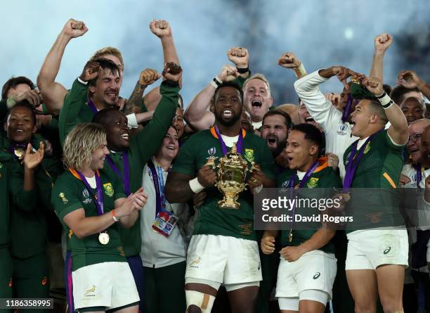 Siya Kolisi, the South Africa captain, raises the Webb Ellis Cup after their victory during the Rugby World Cup 2019 Final between England and South...