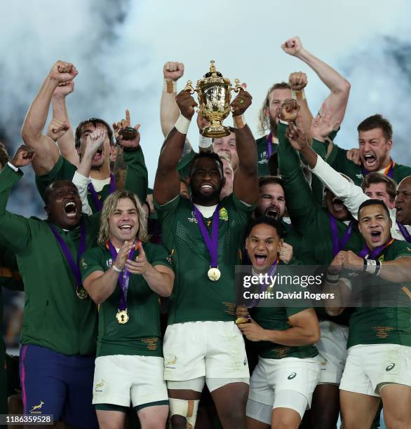 Siya Kolisi, the South Africa captain, raises the Webb Ellis Cup after their victory during the Rugby World Cup 2019 Final between England and South...