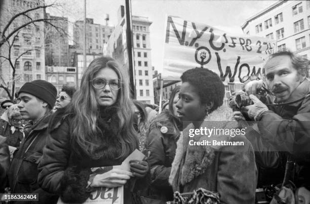 Rep. Bella Abzug, , feminist Gloria Steinem and Lt. Gov. Maryann Krupsak of New York chat with the marchers and newsmen in midtown Manhattan prior to...