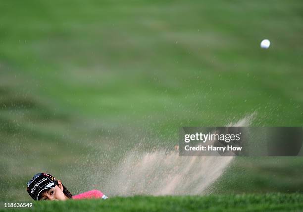 Shinobu Moromizato of Japan hits out of the bunker on the 10th hole during the third round of the 2011 U.S. Women's Open at The Broadmoor on July 9,...