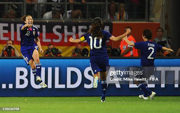 Karina Maruyama of Japan celebrates with team mates Homare Sawa and Yukari Kinga after scoring the winning goal during the FIFA Women's World Cup...