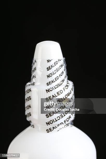safety seal on a medical fluid bottle - 生理食塩水 ストックフォトと画像