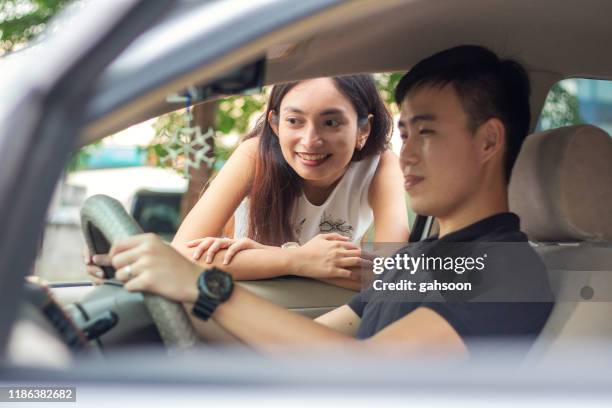 happy young couple discuss on new car purchase, customer satisfaction - test drive stock pictures, royalty-free photos & images