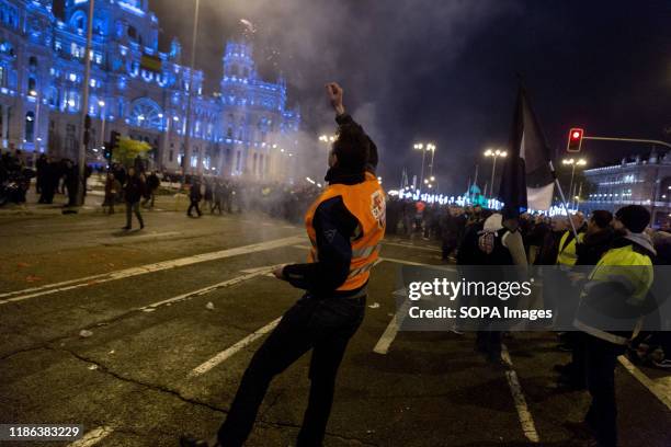 Protester throws firecrackers during the demonstration. EMT workers protest supported by Metro and taxi workers. The bus drivers of the public urban...