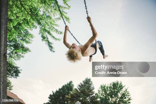 boy high on a swing - using a swing stock pictures, royalty-free photos & images