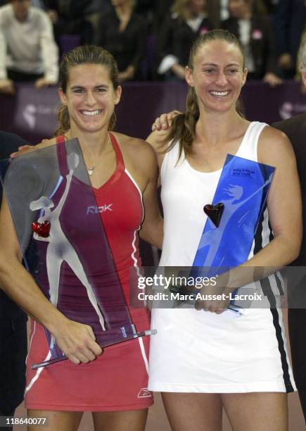 Amelie Mauresmo and Mary Pierce stand with trophies. Amelie Mauresmo defeated French compatriot Mary Pierce 6-1, 7-6 to win the Gaz de France on...