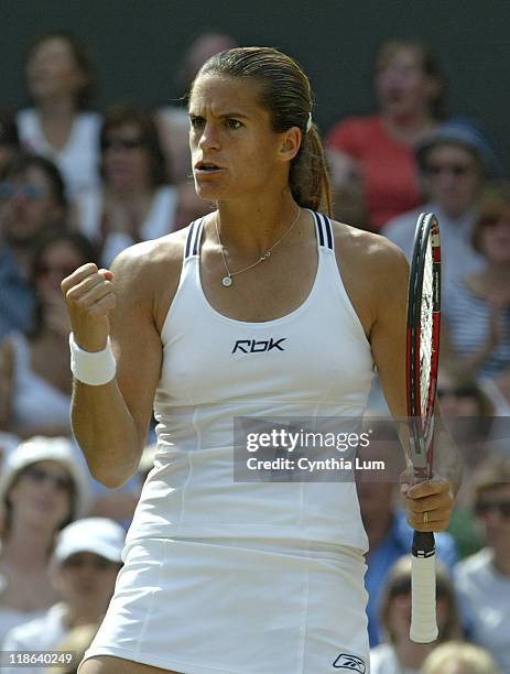 Amelie Mauresmo hits a winner versus Justine Henin-Hardenne in the Ladies Finals of the 2006 Wimbledon Championships at the All England Lawn Tennis &...