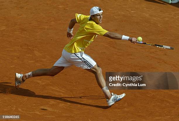 France's Paul-Henri Mathieu lunges to hit a return versus Spain's Rafael Nadal during the third round of the 2006 French Open men's singles, Paris....