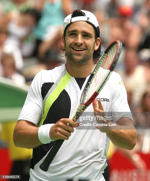 Nicolas Kiefer defeats Juan Ignacio Chela 7-6 , 6-3, 6-3 to move into the quarter-final at the Australian Open, Melbourne, Australia