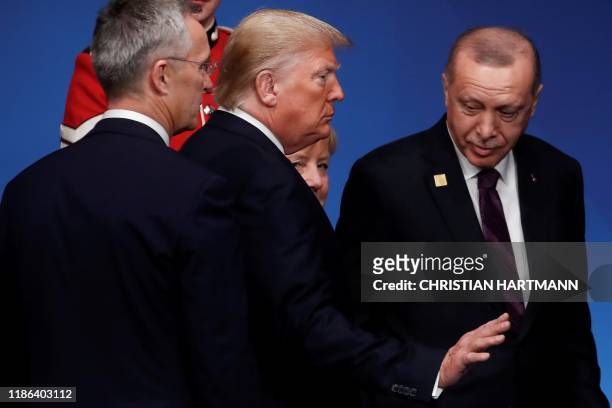 Secretary General Jens Stoltenberg , US President Donald Trump , Turkey's President Tayyip Erdogan and Germany's Chancellor Angela Merkel attend the...