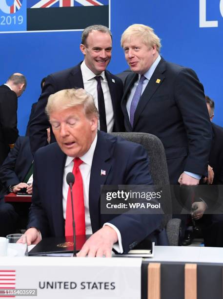 President Donald Trump with Foreign Secretary Dominic Raab and British Prime Minister Boris Johnson onstage during the annual Nato heads of...