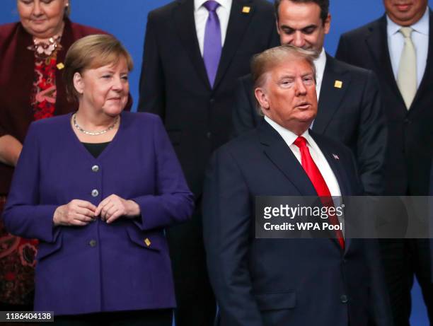 Chancellor of Germany Angela Merkel and US President Donald Trump stand onstage during the annual NATO heads of government summit on December 4, 2019...