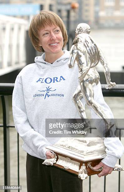 London Marathon 2006 winner Deena Kasta from the USA with her winners trophy, April 24 during a photocall held at Tower Bridge in London.