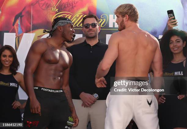 And Logan Paul face off as promoter Eddie Hearn looks on after the official weigh-in at L.A. Live Xbox Plaza on November 08, 2019 in Los Angeles,...