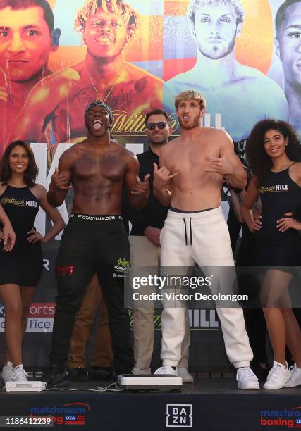 Logan Paul mocks and imitates KSI while promoter Eddie Hearn looks on after the official weigh-in at L.A. Live Xbox Plaza on November 08, 2019 in Los...