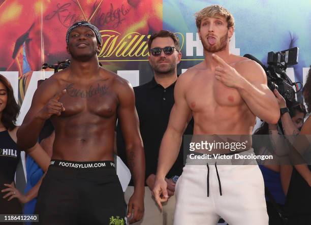 Logan Paul mocks and imitates KSI while promoter Eddie Hearn looks on after the official weigh-in at L.A. Live Xbox Plaza on November 08, 2019 in Los...