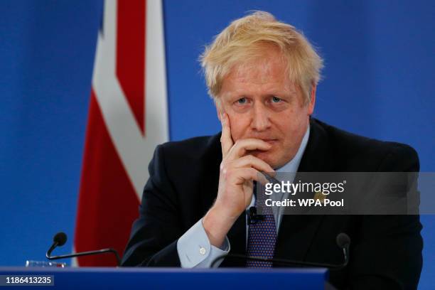 Britain's Prime Minister Boris Johnson gives a press conference at the NATO summit at the Grove hotel on December 4, 2019 in Watford, England. France...