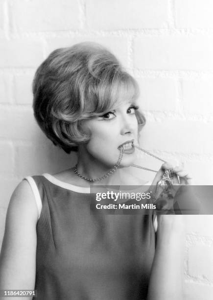 American comedienne, actress, singer and businesswoman Edie Adams poses for a portrait during the Muriel Cigars product shoot circa 1960's in Los...