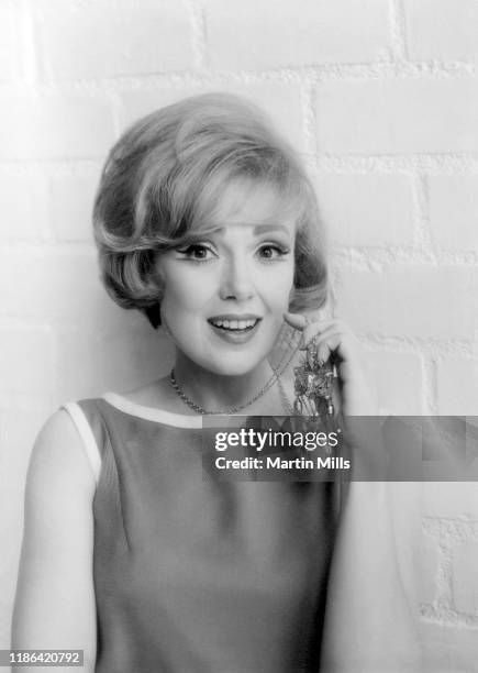 American comedienne, actress, singer and businesswoman Edie Adams poses for a portrait during the Muriel Cigars product shoot circa 1960's in Los...