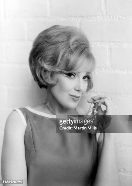 American comedienne, actress, singer and businesswoman Edie Adams poses for a portrait during the Muriel Cigars product shoot circa 1960's in Los...