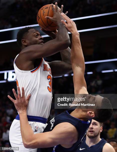 Julius Randle of the New York Knicks takes a shot against Dwight Powell of the Dallas Mavericks in the first half at American Airlines Center on...