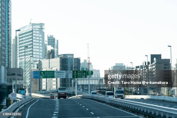 urban highway in yokohama city of japan - japanese exit sign stock pictures, royalty-free photos & images