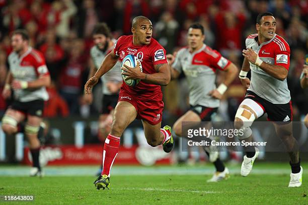 Will Genia of the Reds makes a break during the 2011 Super Rugby Grand Final match between the Reds and the Crusaders at Suncorp Stadium on July 9,...