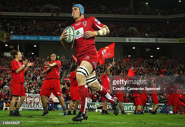 Reds captain James Horwill leads his team onto the field during the 2011 Super Rugby Grand Final match between the Reds and the Crusaders at Suncorp...