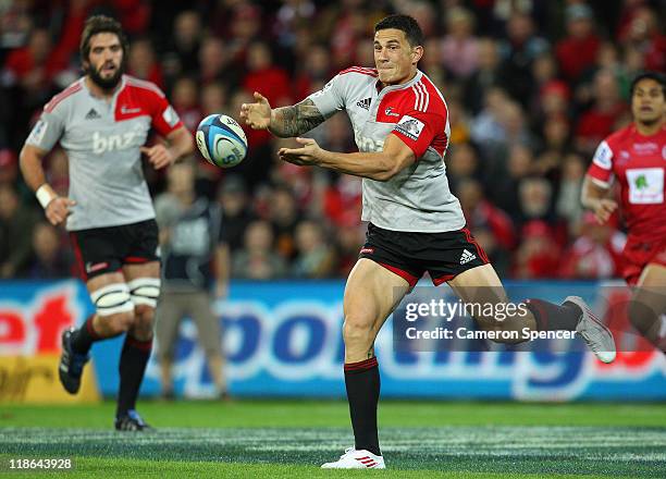 Sonny Bill Williams of the Crusaders passes during the 2011 Super Rugby Grand Final match between the Reds and the Crusaders at Suncorp Stadium on...