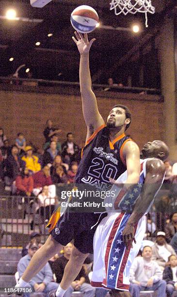Marcus Mason of the Long Beach Jam shoots over Kevin Holland of the Las Vegas Rattlers during 136-124 victory in ABA game at the Las Vegas Events...