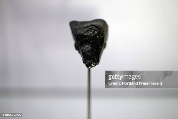 Meteorite, dubbed "Black Beauty," is one of several meteorites that originated on Mars before landing on Earth is in a display case in Maine Mineral...