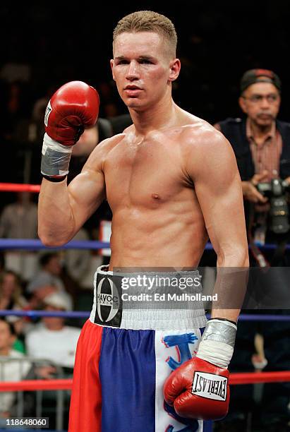 Undefeated featherweight Jason Litzau poses after knocking out Carlos Contreras in 6th round. The bout took place on the undercard of the Arturo...