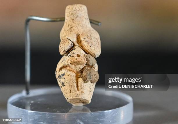 This picture taken on December 4, 2019 shows a 4 centimeters high paleolithic statuette named "Venus of Renancourt", in Amiens. - A small paleolithic...