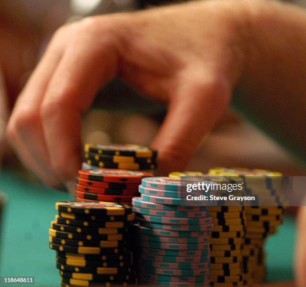 Player stacks his winnings during day six of the 2004 World Series of Poker at Binion's Horseshoe Club and Casino in Las Vegas, Nevada May 27, 2004.