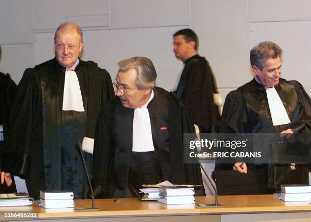 Le président de la Cour de Justice de la République, Christian Le Gunehec , entouré par le magistrat Bernard le Gall et le sénateur Michel...