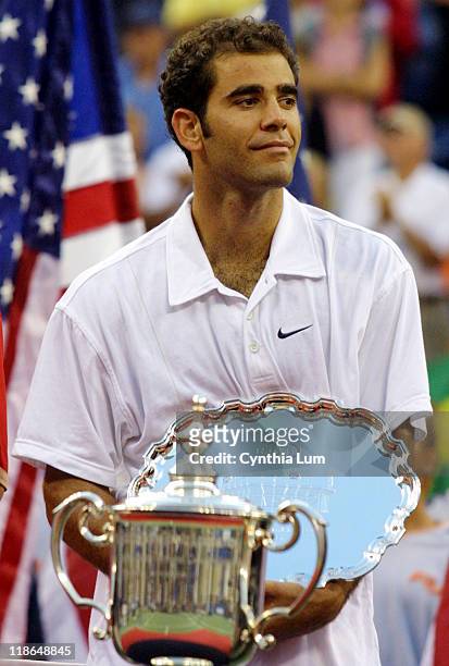 Pete Sampras hold second place trophy after his 7-6 , 6-1, 6-1 loss to Lleyton Hewitt