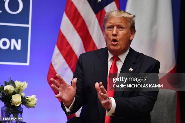 President Donald Trump speaks during a bilateral meeting with Italy's Prime Minister Giuseppe Conte at the NATO summit at the Grove hotel in Watford,...