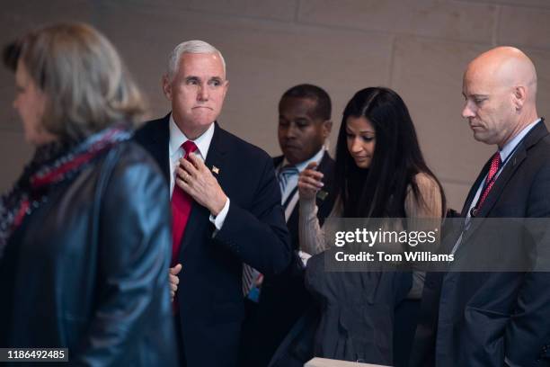 Vice President Mike Pence, his chief of staff Marc Short, right, and press secretary Katie Waldman, center, arrive for a meeting of the House...
