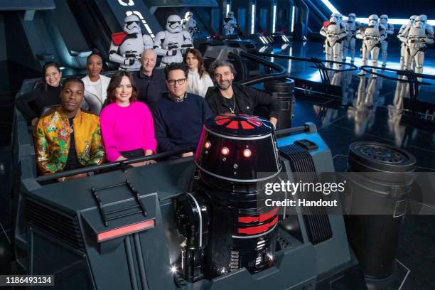 In this handout photo provided by Disney Resort, the cast of the upcoming film, Star Wars: The Rise of Skywalker, John Boyega, Daisy Ridley, director...