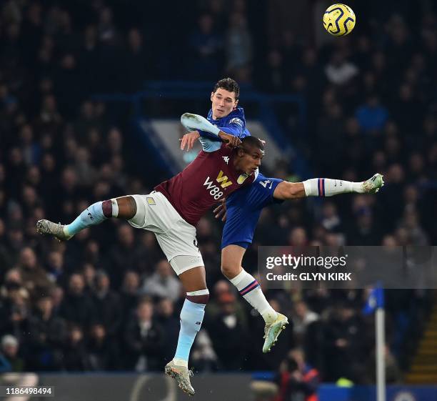 Chelsea's Danish defender Andreas Christensen vies with header the ball with Aston Villa's English defender Axel Tuanzebe during the English Premier...