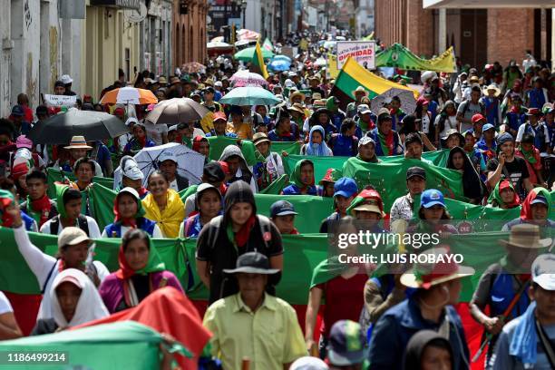 Indigenous people march against Colombian President Ivan Duque in Cali, Colombia, on December 4, 2019. - Protests in Colombia, which are entering the...