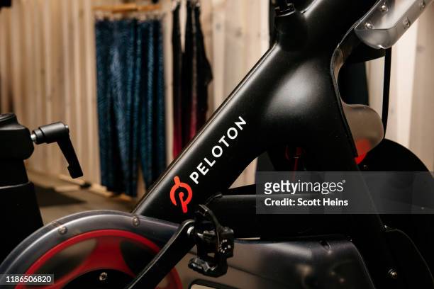 Peloton stationary bike sits on display at one of the fitness company's studios on December 4, 2019 in New York City. Peloton and its model of...